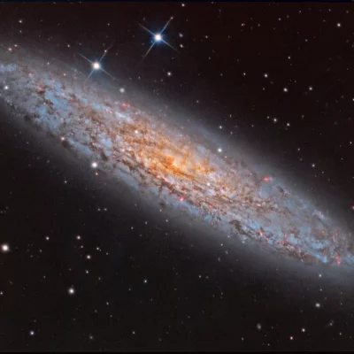 تصویر روز ناسا: NGC 253 کهکشان غبارآلود